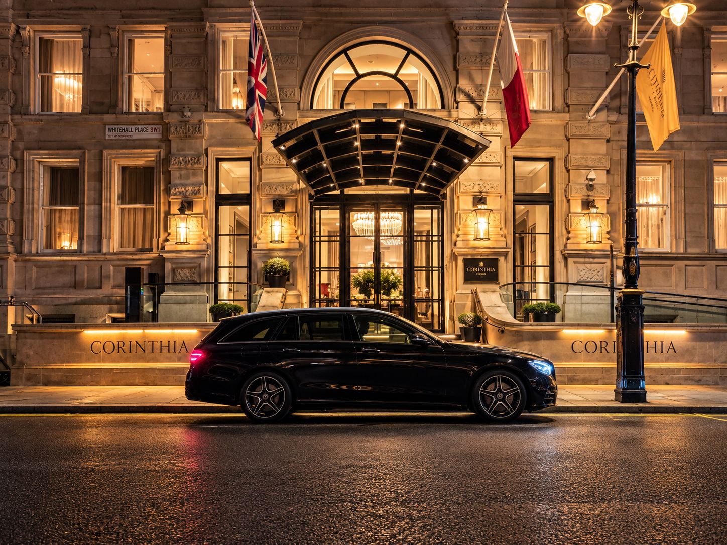 Black Mercedes executive estate outside the Corinthia hotel entrance, London